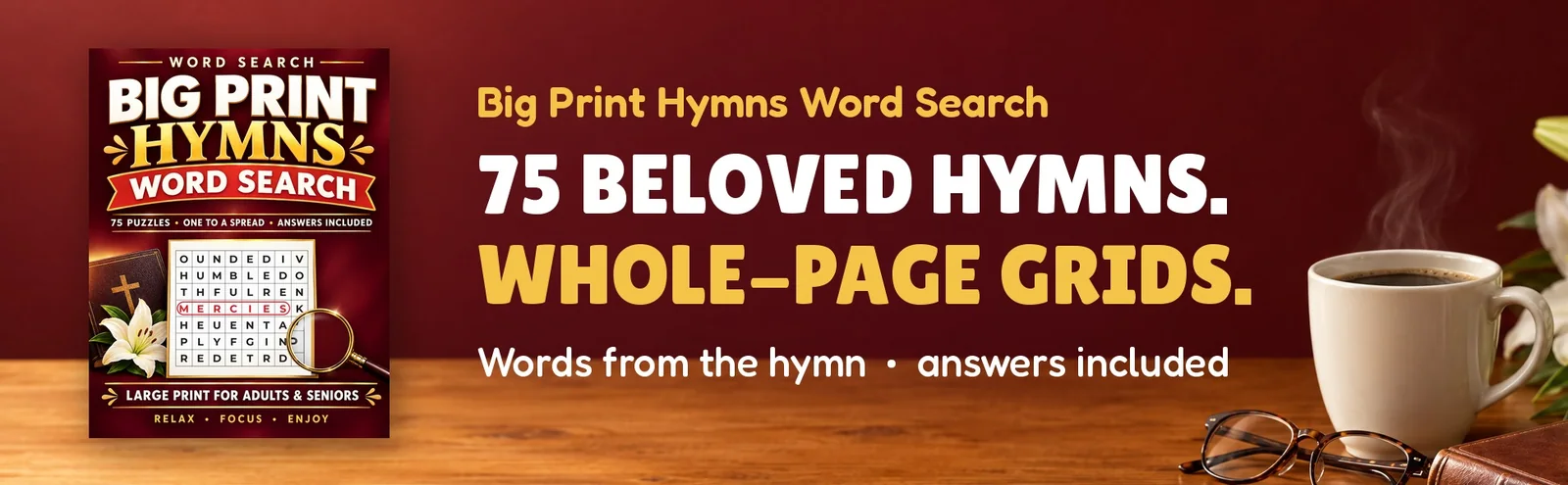 The Big Print Hymns Word Search cover on a wooden table beside coffee, reading glasses and lilies.